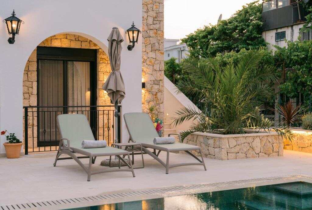 Sun loungers on the pool terrace at B&B Lovac Pool & Spa